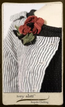 Campanella Shirt Jacket in Black and White Petite Stripe Linen; Bertie Frock in Black Puckered Check Weave; Cilla Slip Frock in Signature Black Lightweight Linen Knit; Floravinea Brooch in Rosy Washed Crinkled Linen. By Ivey Abitz.