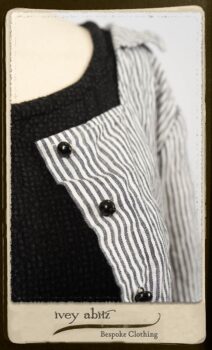 Campanella Shirt Jacket in Black and White Petite Stripe Linen; Bertie Frock in Black Puckered Check Weave; Cilla Slip Frock in Signature Black Lightweight Linen Knit; Floravinea Brooch in Rosy Washed Crinkled Linen. By Ivey Abitz.