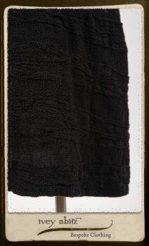 Campanella Shirt Jacket in Black and White Petite Stripe Linen; Bertie Frock in Black Puckered Check Weave; Cilla Slip Frock in Signature Black Lightweight Linen Knit; Floravinea Brooch in Rosy Washed Crinkled Linen. By Ivey Abitz.