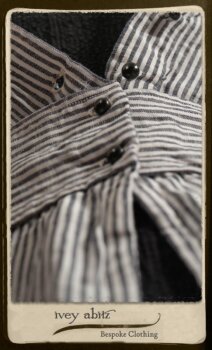 Campanella Shirt Jacket in Black and White Petite Stripe Linen; Bertie Frock in Black Puckered Check Weave; Cilla Slip Frock in Signature Black Lightweight Linen Knit; Floravinea Brooch in Rosy Washed Crinkled Linen. By Ivey Abitz.