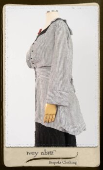 Campanella Shirt Jacket in Black and White Petite Stripe Linen; Bertie Frock in Black Puckered Check Weave; Cilla Slip Frock in Signature Black Lightweight Linen Knit; Floravinea Brooch in Rosy Washed Crinkled Linen. By Ivey Abitz.