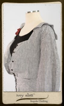 Campanella Shirt Jacket in Black and White Petite Stripe Linen; Bertie Frock in Black Puckered Check Weave; Cilla Slip Frock in Signature Black Lightweight Linen Knit; Floravinea Brooch in Rosy Washed Crinkled Linen. By Ivey Abitz.