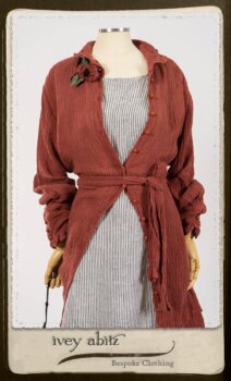 Scattergood Duster Coat in Rosy Washed Crinkled Linen; Scattergood Frock in Black and White Petite Stripe Linen; Floravinea Brooch in Rosy Washed Crinkled Linen. By Ivey Abitz.