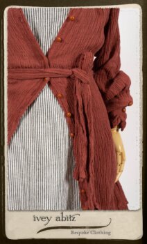 Scattergood Duster Coat in Rosy Washed Crinkled Linen; Scattergood Frock in Black and White Petite Stripe Linen; Floravinea Brooch in Rosy Washed Crinkled Linen. By Ivey Abitz.