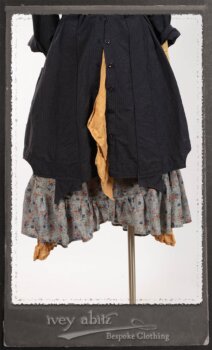 Vanetten Duster Coat in Fresh Water Petite Check Cotton; Blanchefleur Sash in New Sun Washed Linen; Tilbrook Frock in New Sun Washed Linen; Edenshire Frock in New Sun Washed Linen in High Water Length. By Ivey Abitz.