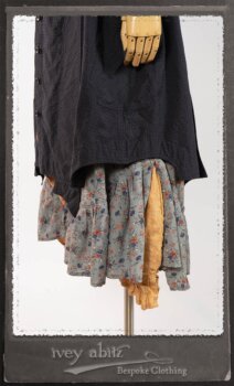 Vanetten Duster Coat in Fresh Water Petite Check Cotton; Blanchefleur Sash in New Sun Washed Linen; Tilbrook Frock in New Sun Washed Linen; Edenshire Frock in New Sun Washed Linen in High Water Length. By Ivey Abitz.