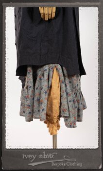 Vanetten Duster Coat in Fresh Water Petite Check Cotton; Blanchefleur Sash in New Sun Washed Linen; Tilbrook Frock in New Sun Washed Linen; Edenshire Frock in New Sun Washed Linen in High Water Length. By Ivey Abitz.