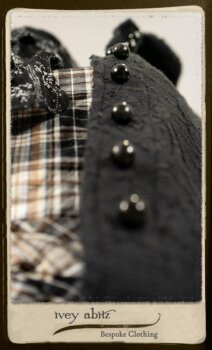 Bramley Frock in Black and White Picture Book Plaid; Clotaire Sash in White on Black Floral Silk Chiffon; Bertie Jacket in Black Floral Raised Knit; Bertie Frock in Black Puckered Check Weave. By Ivey Abitz.