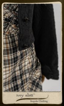 Bramley Frock in Black and White Picture Book Plaid; Clotaire Sash in White on Black Floral Silk Chiffon; Bertie Jacket in Black Floral Raised Knit; Bertie Frock in Black Puckered Check Weave. By Ivey Abitz.