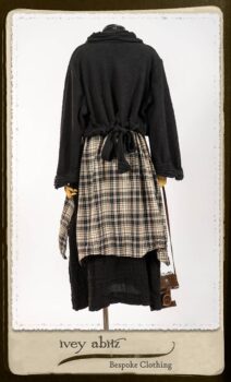 Bramley Frock in Black and White Picture Book Plaid; Clotaire Sash in White on Black Floral Silk Chiffon; Bertie Jacket in Black Floral Raised Knit; Bertie Frock in Black Puckered Check Weave. By Ivey Abitz.