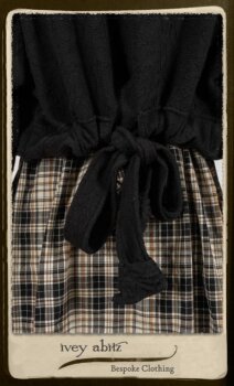 Bramley Frock in Black and White Picture Book Plaid; Clotaire Sash in White on Black Floral Silk Chiffon; Bertie Jacket in Black Floral Raised Knit; Bertie Frock in Black Puckered Check Weave. By Ivey Abitz.