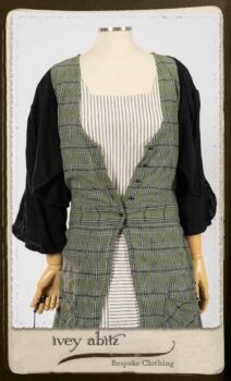 Campanella Overlay in New Day Washed Plaid Gauze; Addy Jacket in Signature Black Lightweight Linen Knit; Campanella Frock in New Day Washed Stripe Linen. By Ivey Abitz.