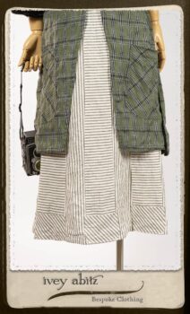 Campanella Overlay in New Day Washed Plaid Gauze; Addy Jacket in Signature Black Lightweight Linen Knit; Campanella Frock in New Day Washed Stripe Linen. By Ivey Abitz.