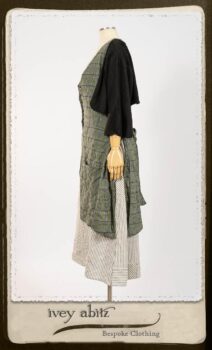 Campanella Overlay in New Day Washed Plaid Gauze; Addy Jacket in Signature Black Lightweight Linen Knit; Campanella Frock in New Day Washed Stripe Linen. By Ivey Abitz.