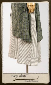 Campanella Overlay in New Day Washed Plaid Gauze; Addy Jacket in Signature Black Lightweight Linen Knit; Campanella Frock in New Day Washed Stripe Linen. By Ivey Abitz.