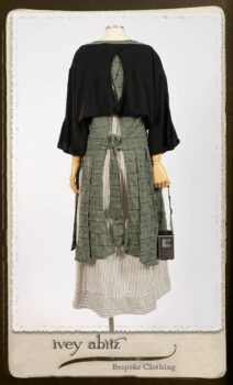 Campanella Overlay in New Day Washed Plaid Gauze; Addy Jacket in Signature Black Lightweight Linen Knit; Campanella Frock in New Day Washed Stripe Linen. By Ivey Abitz.