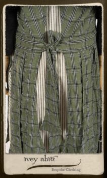 Campanella Overlay in New Day Washed Plaid Gauze; Addy Jacket in Signature Black Lightweight Linen Knit; Campanella Frock in New Day Washed Stripe Linen. By Ivey Abitz.