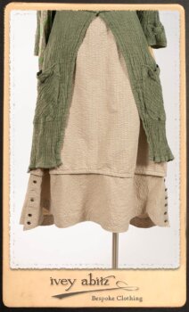 Campanella Duster Coat in New Day Washed Crinkled Linen; Harrison Frock in Picture Book Puckered Stripe Cotton; Blanchefleur Sash in New Day Floral Cotton Voile. By Ivey Abitz.