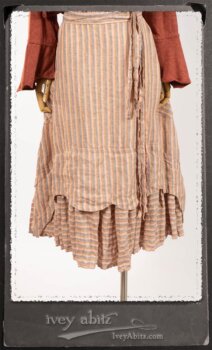 Crest Jacket in New Sun Softest Knit; Heraldry Frock in Rosy Washed Stripe Linen in High Water Length; Porte Cochere Sash in Rosy Washed Stripe Linen. By Ivey Abitz.