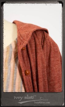 Crest Jacket in New Sun Softest Knit; Heraldry Frock in Rosy Washed Stripe Linen in High Water Length; Porte Cochere Sash in Rosy Washed Stripe Linen. By Ivey Abitz.