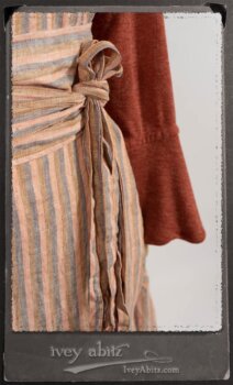 Crest Jacket in New Sun Softest Knit; Heraldry Frock in Rosy Washed Stripe Linen in High Water Length; Porte Cochere Sash in Rosy Washed Stripe Linen. By Ivey Abitz.