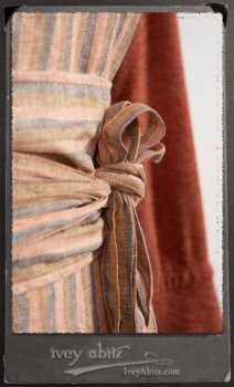 Crest Jacket in New Sun Softest Knit; Heraldry Frock in Rosy Washed Stripe Linen in High Water Length; Porte Cochere Sash in Rosy Washed Stripe Linen. By Ivey Abitz.