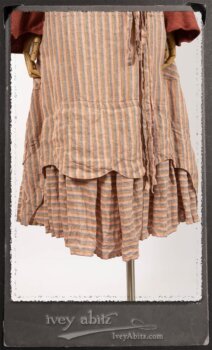 Crest Jacket in New Sun Softest Knit; Heraldry Frock in Rosy Washed Stripe Linen in High Water Length; Porte Cochere Sash in Rosy Washed Stripe Linen. By Ivey Abitz.