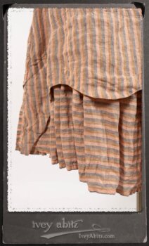 Crest Jacket in New Sun Softest Knit; Heraldry Frock in Rosy Washed Stripe Linen in High Water Length; Porte Cochere Sash in Rosy Washed Stripe Linen. By Ivey Abitz.