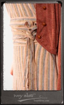 Crest Jacket in New Sun Softest Knit; Heraldry Frock in Rosy Washed Stripe Linen in High Water Length; Porte Cochere Sash in Rosy Washed Stripe Linen. By Ivey Abitz.