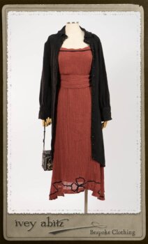 Truitt Shirt Jacket in Black Puckered Check Weave; Monceau Frock in Rosy Washed Crinkled Linen; Cilla Slip Frock in Signature Black Lightweight Linen Knit with Square Collar; Clotaire Sash in Rosy Washed Crinkled Linen. By Ivey Abitz.