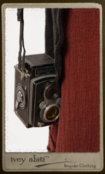 Truitt Shirt Jacket in Black Puckered Check Weave; Monceau Frock in Rosy Washed Crinkled Linen; Cilla Slip Frock in Signature Black Lightweight Linen Knit with Square Collar; Clotaire Sash in Rosy Washed Crinkled Linen. By Ivey Abitz.