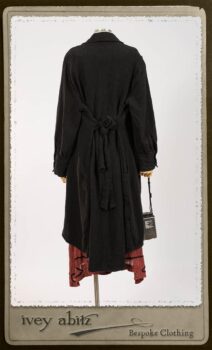 Truitt Shirt Jacket in Black Puckered Check Weave; Monceau Frock in Rosy Washed Crinkled Linen; Cilla Slip Frock in Signature Black Lightweight Linen Knit with Square Collar; Clotaire Sash in Rosy Washed Crinkled Linen. By Ivey Abitz.