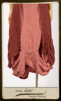 Scattergood Duster Coat in Rosy Washed Crinkled Linen; Porte Cochere Sash in Rosy Washed Floral Linen; Scattergood Frock in Rosy Washed Cotton. By Ivey Abitz.