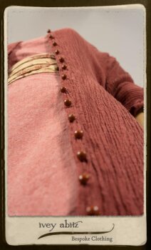 Scattergood Duster Coat in Rosy Washed Crinkled Linen; Porte Cochere Sash in Rosy Washed Floral Linen; Scattergood Frock in Rosy Washed Cotton. By Ivey Abitz.