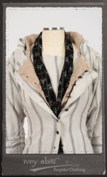 Harrison Duster Coat in Black and White Picture Book Stripe; Harrison Shirt Jacket in Picture Book Washed Crinkled Linen; Clotaire Sash in White on Black Floral Silk Chiffon; Fairholme Frock in Black and White Picture Book Stripe. By Ivey Abitz.