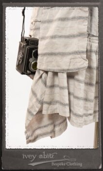 Harrison Duster Coat in Black and White Picture Book Stripe; Harrison Shirt Jacket in Picture Book Washed Crinkled Linen; Clotaire Sash in White on Black Floral Silk Chiffon; Fairholme Frock in Black and White Picture Book Stripe. By Ivey Abitz.