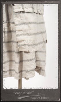 Harrison Duster Coat in Black and White Picture Book Stripe; Harrison Shirt Jacket in Picture Book Washed Crinkled Linen; Clotaire Sash in White on Black Floral Silk Chiffon; Fairholme Frock in Black and White Picture Book Stripe. By Ivey Abitz.