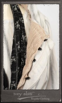 Harrison Duster Coat in Black and White Picture Book Stripe; Harrison Shirt Jacket in Picture Book Washed Crinkled Linen; Clotaire Sash in White on Black Floral Silk Chiffon; Fairholme Frock in Black and White Picture Book Stripe. By Ivey Abitz.