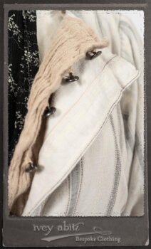 Harrison Duster Coat in Black and White Picture Book Stripe; Harrison Shirt Jacket in Picture Book Washed Crinkled Linen; Clotaire Sash in White on Black Floral Silk Chiffon; Fairholme Frock in Black and White Picture Book Stripe. By Ivey Abitz.