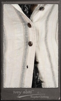 Harrison Duster Coat in Black and White Picture Book Stripe; Harrison Shirt Jacket in Picture Book Washed Crinkled Linen; Clotaire Sash in White on Black Floral Silk Chiffon; Fairholme Frock in Black and White Picture Book Stripe. By Ivey Abitz.