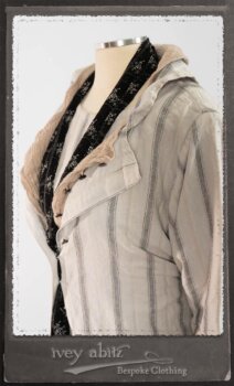 Harrison Duster Coat in Black and White Picture Book Stripe; Harrison Shirt Jacket in Picture Book Washed Crinkled Linen; Clotaire Sash in White on Black Floral Silk Chiffon; Fairholme Frock in Black and White Picture Book Stripe. By Ivey Abitz.