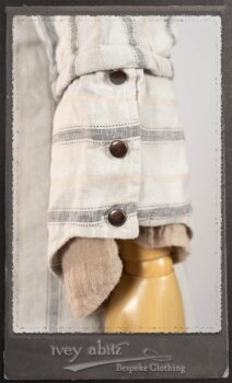 Harrison Duster Coat in Black and White Picture Book Stripe; Harrison Shirt Jacket in Picture Book Washed Crinkled Linen; Clotaire Sash in White on Black Floral Silk Chiffon; Fairholme Frock in Black and White Picture Book Stripe. By Ivey Abitz.