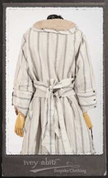 Harrison Duster Coat in Black and White Picture Book Stripe; Harrison Shirt Jacket in Picture Book Washed Crinkled Linen; Clotaire Sash in White on Black Floral Silk Chiffon; Fairholme Frock in Black and White Picture Book Stripe. By Ivey Abitz.