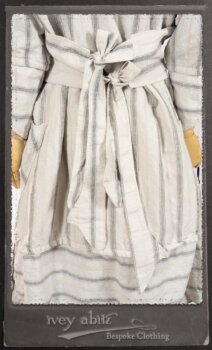 Harrison Duster Coat in Black and White Picture Book Stripe; Harrison Shirt Jacket in Picture Book Washed Crinkled Linen; Clotaire Sash in White on Black Floral Silk Chiffon; Fairholme Frock in Black and White Picture Book Stripe. By Ivey Abitz.