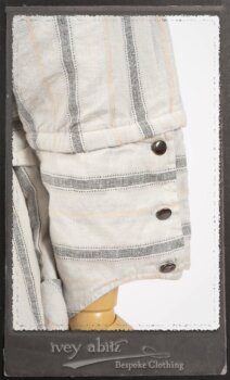 Harrison Duster Coat in Black and White Picture Book Stripe; Harrison Shirt Jacket in Picture Book Washed Crinkled Linen; Clotaire Sash in White on Black Floral Silk Chiffon; Fairholme Frock in Black and White Picture Book Stripe. By Ivey Abitz.