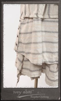 Harrison Duster Coat in Black and White Picture Book Stripe; Harrison Shirt Jacket in Picture Book Washed Crinkled Linen; Clotaire Sash in White on Black Floral Silk Chiffon; Fairholme Frock in Black and White Picture Book Stripe. By Ivey Abitz.