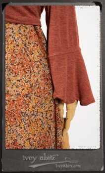 Crest Jacket in New Sun Softest Knit; Blanchefleur Sash in New Sun Washed Linen; Crest Frock in New Sun Floral Silk Chiffon in High Water Length; Edenshire Frock in New Sun Washed Linen in High Water Length. By Ivey Abitz.