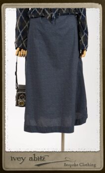 Chevallier Cardigan in Fresh Water Rustic Argyle Knit; Vanetten Frock in Fresh Water Petite Fleur Cotton; Clotaire Sash in Fresh Water Argyle Netting. By Ivey Abitz.