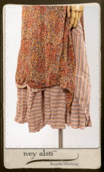 Crest Frock in New Sun Floral Silk Chiffon in High Water Length; Porte Cochere Sash in Rosy Washed Cotton; Heraldry Frock in Rosy Washed Stripe Linen in High Water Length. By Ivey Abitz.