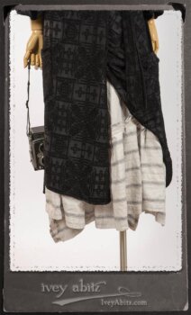 Chomley Frock in Black Embroidered Voile Pinned Back to Side Pocket; Addy Jacket in Signature Black Lightweight Linen Knit; Fairholme Frock in Black and White Picture Book Stripe in High Water Length. By Ivey Abitz.